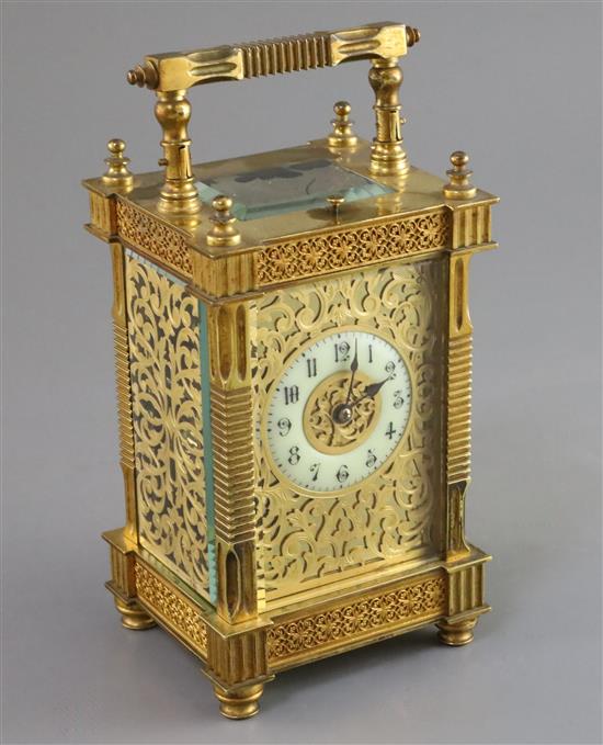 An early 20th century French ormolu hour repeating carriage clock, 6.5in., with red leather travelling case